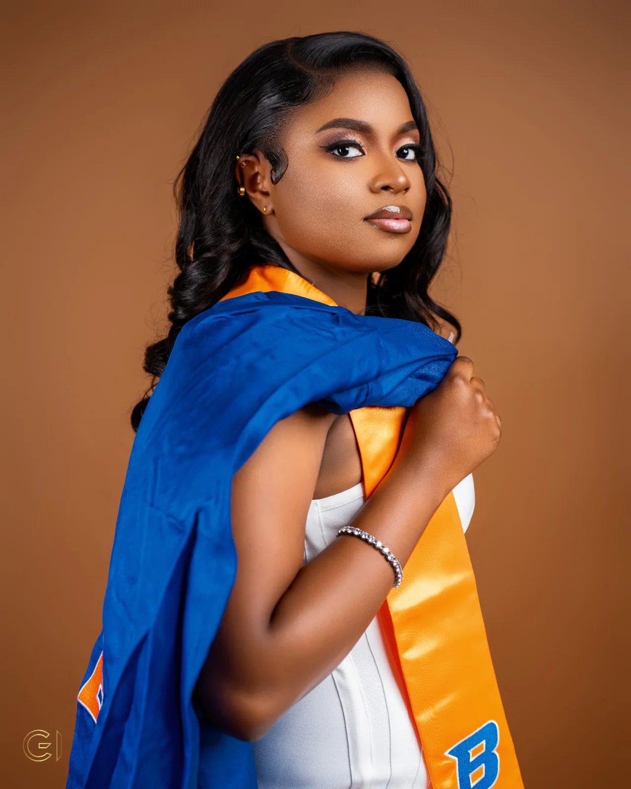 Graduation portrait with blue and orange stole